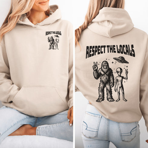 The Respect the Locals Hoodie features this dynamic duo (Big Foot & Alien) striking a pose like they’re on the cover of Paranormal Weekly
