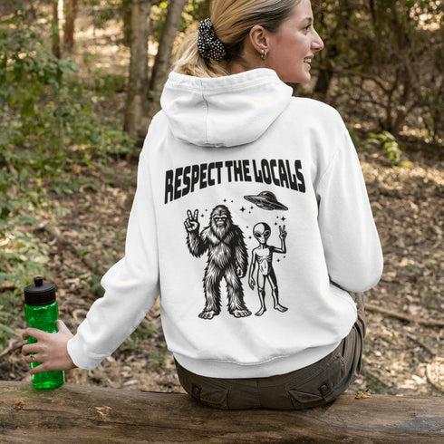 The Respect the Locals Hoodie features this dynamic duo (Big Foot & Alien) striking a pose like they’re on the cover of Paranormal Weekly