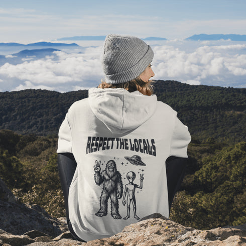 The Respect the Locals Hoodie features this dynamic duo (Big Foot & Alien) striking a pose like they’re on the cover of Paranormal Weekly