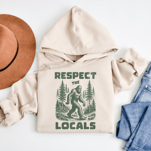 Our Respect the Locals Hoodie features the elusive forest king himself, casually minding his business among the trees with the message: “Respect the Locals.”