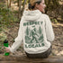 Our Respect the Locals Hoodie features the legend himself—Bigfoot—just casually strolling through the forest like it’s his backyard (because it is).