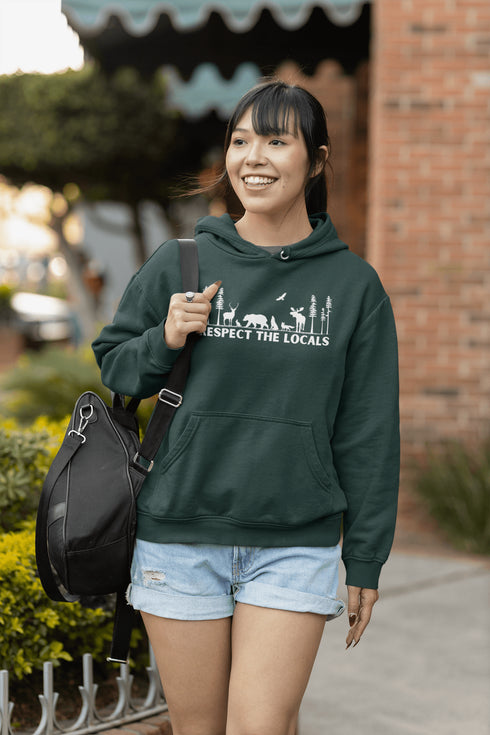 Step into the heart of the forest with our “Respect The Locals” hoodie, where artfully illustrated woodland animals roam under a canopy of trees.