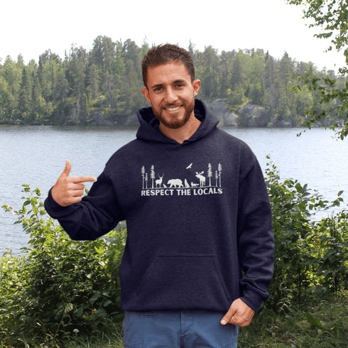 Step into the heart of the forest with our “Respect The Locals” hoodie, where artfully illustrated woodland animals roam under a canopy of trees.