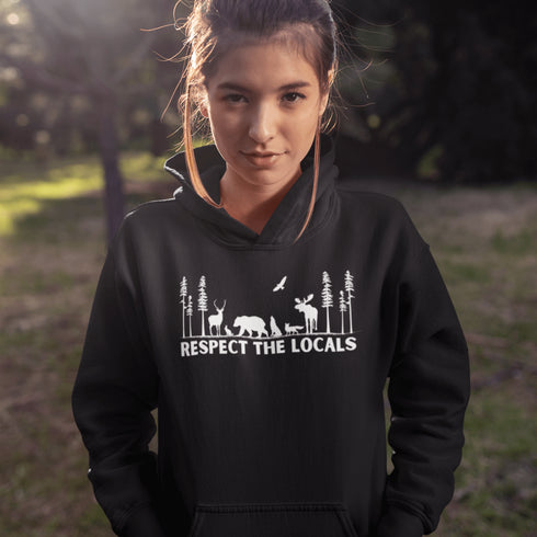 Step into the heart of the forest with our “Respect The Locals” hoodie, where artfully illustrated woodland animals roam under a canopy of trees.