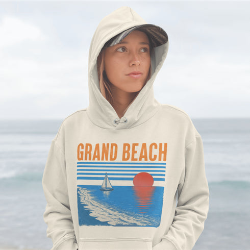 Bring the beauty of beachside sunsets wherever you go with our Grand Beach, Manitoba hoodie.