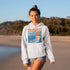 Capture the laid-back charm of lake life with our Winnipeg Beach hoodie. Featuring a vibrant graphic of the town’s iconic water tower set against a beach sunset