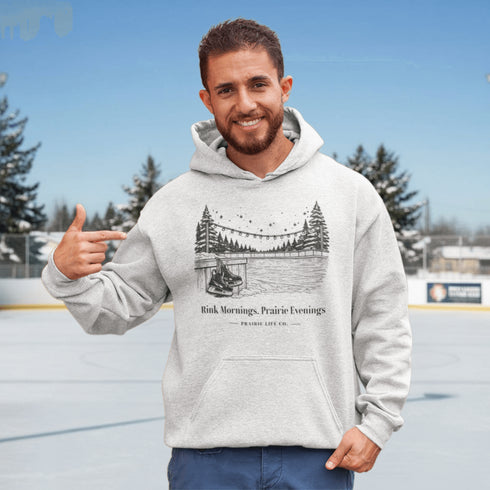 Cozy outdoor hockey hoodie featuring a glowing rink graphic and prairie winter vibe. Perfect for skating, cabin nights, and cold-weather comfort.