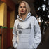 Cozy outdoor hockey hoodie featuring a glowing rink graphic and prairie winter vibe. Perfect for skating, cabin nights, and cold-weather comfort.