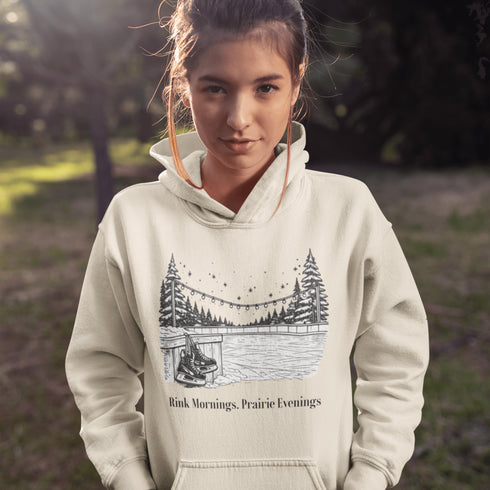 Cozy outdoor hockey hoodie featuring a glowing rink graphic and prairie winter vibe. Perfect for skating, cabin nights, and cold-weather comfort.