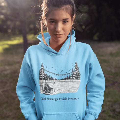 Cozy outdoor hockey hoodie featuring a glowing rink graphic and prairie winter vibe. Perfect for skating, cabin nights, and cold-weather comfort.