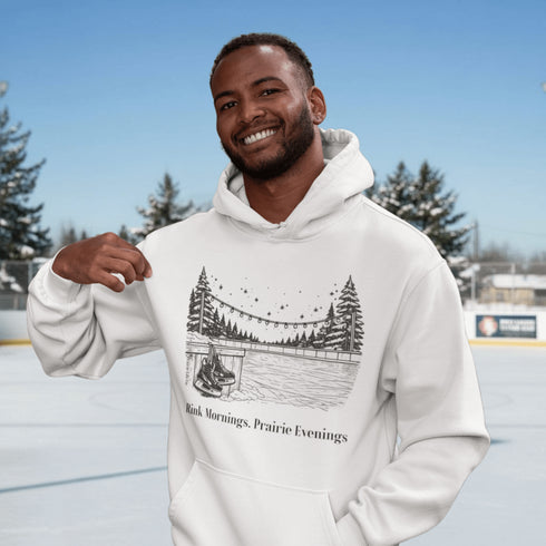 Cozy outdoor hockey hoodie featuring a glowing rink graphic and prairie winter vibe. Perfect for skating, cabin nights, and cold-weather comfort.