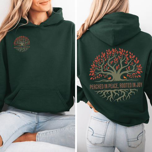 This design features a beautifully crafted tree with flowing roots, symbolizing strength and connection, paired with the uplifting saying, "Perched in peace, rooted in joy."