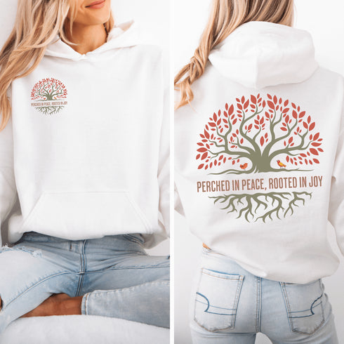 This design features a beautifully crafted tree with flowing roots, symbolizing strength and connection, paired with the uplifting saying, "Perched in peace, rooted in joy."