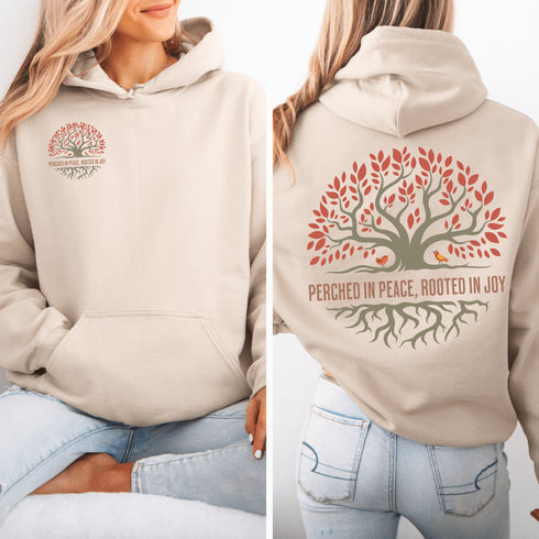This design features a beautifully crafted tree with flowing roots, symbolizing strength and connection, paired with the uplifting saying, "Perched in peace, rooted in joy."