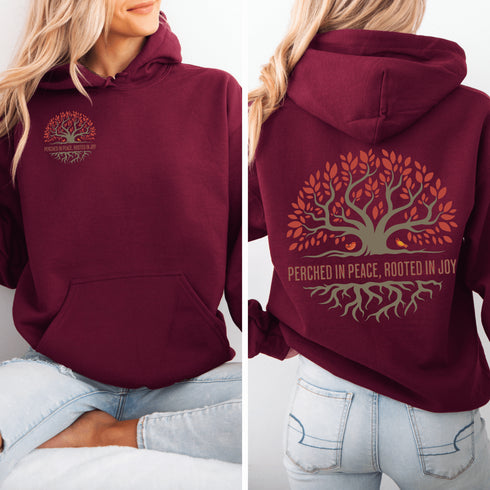 This design features a beautifully crafted tree with flowing roots, symbolizing strength and connection, paired with the uplifting saying, "Perched in peace, rooted in joy."