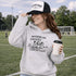 Soccer mom hoodie with “Running on Coffee and Game Day Chaos” design featuring moms cheering on the sidelines with kids playing soccer in the background
