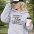 Soccer mom hoodie with “Running on Coffee and Game Day Chaos” design featuring moms cheering on the sidelines with kids playing soccer in the background