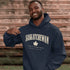 Saskatchewan Land of Living Skies unisex hoodie with vintage collegiate lettering and maple leaf graphic by Prairie Life Co.