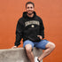 Saskatchewan Land of Living Skies unisex hoodie with vintage collegiate lettering and maple leaf graphic by Prairie Life Co.