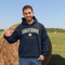 Saskatchewan Land of Living Skies unisex hoodie with vintage collegiate lettering and maple leaf graphic by Prairie Life Co.
