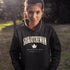 Saskatchewan Land of Living Skies unisex hoodie with vintage collegiate lettering and maple leaf graphic by Prairie Life Co.