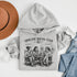 Soccer mom hoodie with “Sideline Social Club” design featuring moms sitting in lawn chairs drinking coffee while watching kids play soccer in the background