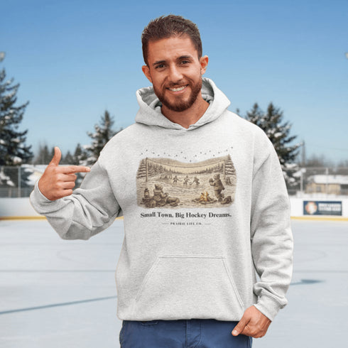 Small Town Big Hockey Dreams Hoodie – nostalgic pond hockey sweatshirt with campfire winter scene. Cozy unisex fit. Multiple colors available.