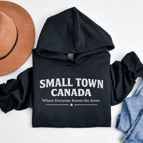 Cozy Small Town Canada hockey hoodie inspired by outdoor rink life. Warm fleece sweatshirt perfect for winter skating and small-town pride.
