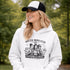 Soccer moms hoodie with “Soccer Moms Club Caffeine and Chaos” design featuring moms holding coffee cups and watching kids play soccer in the background