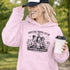 Soccer moms hoodie with “Soccer Moms Club Caffeine and Chaos” design featuring moms holding coffee cups and watching kids play soccer in the background