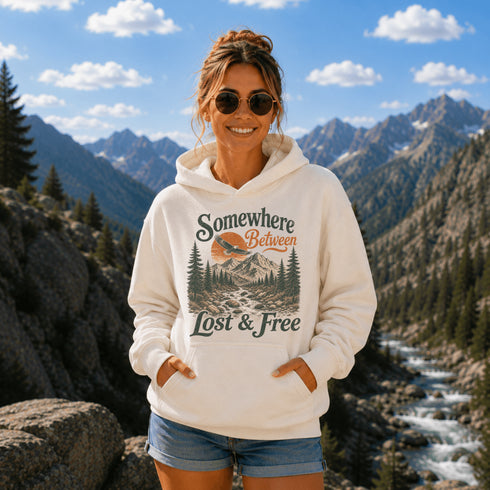 Vintage mountain adventure hoodie featuring a scenic outdoor landscape graphic on a Gildan 18500 Heavy Blend hoodie, shown in a lifestyle mockup. Available in multiple colors with a relaxed unisex fit.