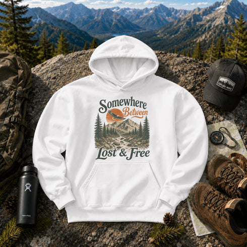 Vintage mountain adventure hoodie featuring a scenic outdoor landscape graphic on a Gildan 18500 Heavy Blend hoodie, shown in a lifestyle mockup. Available in multiple colors with a relaxed unisex fit.
