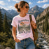 Woman wearing vintage mountain hiking t-shirt with Somewhere Between Lost & Free design