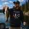 Unisex Gildan 18500 hoodie featuring a humorous fishing-themed graphic design, available in multiple colors for outdoor, lake life, camping, and everyday wear.