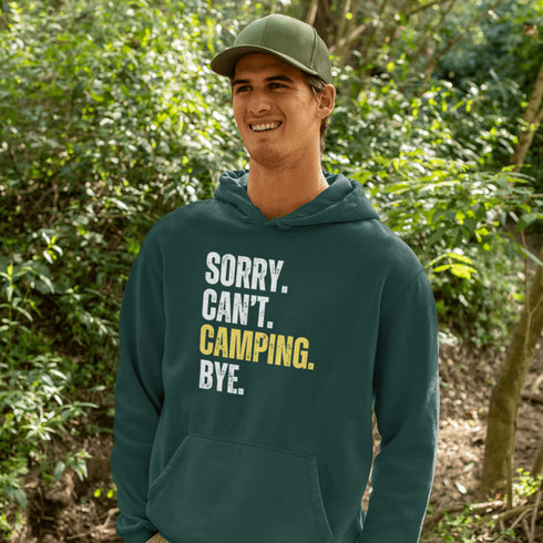 Introducing the ultimate escape gear for all the weekend warriors, the "Sorry. Can't. Camping. Bye." hoodie! This isn't just any ordinary piece of clothing; it's your ticket to avoiding all unwanted plans, chores, and responsibilities.