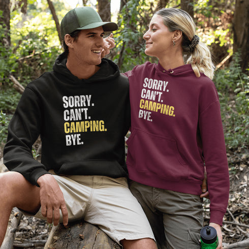 Introducing the ultimate escape gear for all the weekend warriors, the "Sorry. Can't. Camping. Bye." hoodie! This isn't just any ordinary piece of clothing; it's your ticket to avoiding all unwanted plans, chores, and responsibilities.