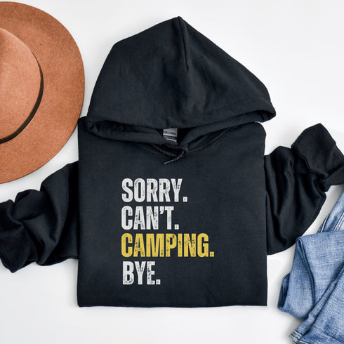 Introducing the ultimate escape gear for all the weekend warriors, the "Sorry. Can't. Camping. Bye." hoodie! This isn't just any ordinary piece of clothing; it's your ticket to avoiding all unwanted plans, chores, and responsibilities.