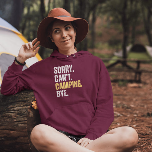 Introducing the ultimate escape gear for all the weekend warriors, the "Sorry. Can't. Camping. Bye." hoodie! This isn't just any ordinary piece of clothing; it's your ticket to avoiding all unwanted plans, chores, and responsibilities.