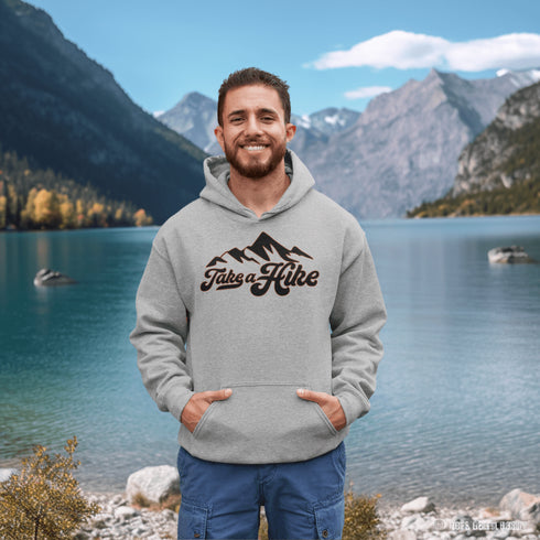 Introducing our rugged and stylish hiking hoodie, perfect for outdoor enthusiasts and nature lovers alike. Featuring a striking mountain graphic and the motivational slogan "Take A Hike", this sweater is designed to inspire your next camping adventure.