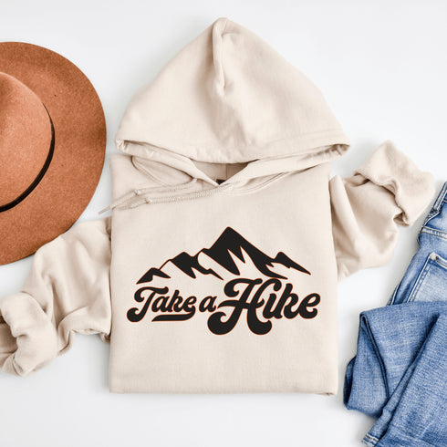 Introducing our rugged and stylish hiking hoodie, perfect for outdoor enthusiasts and nature lovers alike. Featuring a striking mountain graphic and the motivational slogan "Take A Hike", this sweater is designed to inspire your next camping adventure.