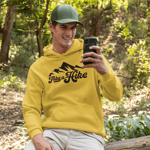 Introducing our rugged and stylish hiking hoodie, perfect for outdoor enthusiasts and nature lovers alike. Featuring a striking mountain graphic and the motivational slogan "Take A Hike", this sweater is designed to inspire your next camping adventure.