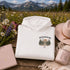 Vintage-inspired outdoor hoodie featuring a matching left chest graphic and large back graphic, displayed in a lifestyle mockup inspired by hiking, camping, scenic mountain roads, and outdoor adventures.
