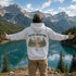 Vintage-inspired outdoor hoodie featuring a matching left chest graphic and large back graphic, displayed in a lifestyle mockup inspired by hiking, camping, scenic mountain roads, and outdoor adventures.