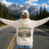Vintage-inspired outdoor hoodie featuring a matching left chest graphic and large back graphic, displayed in a lifestyle mockup inspired by hiking, camping, scenic mountain roads, and outdoor adventures.