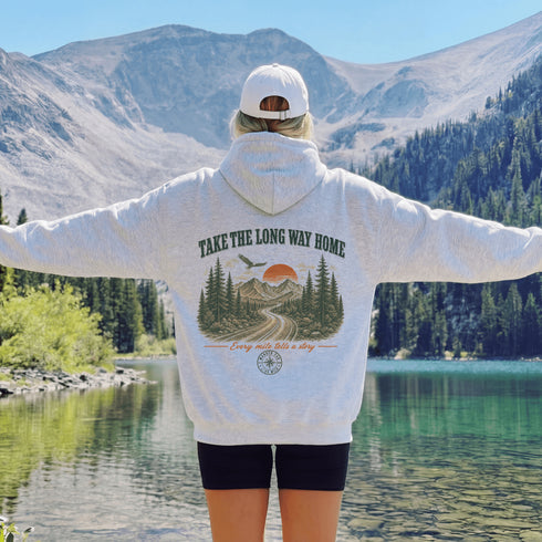 Vintage-inspired outdoor hoodie featuring a matching left chest graphic and large back graphic, displayed in a lifestyle mockup inspired by hiking, camping, scenic mountain roads, and outdoor adventures.