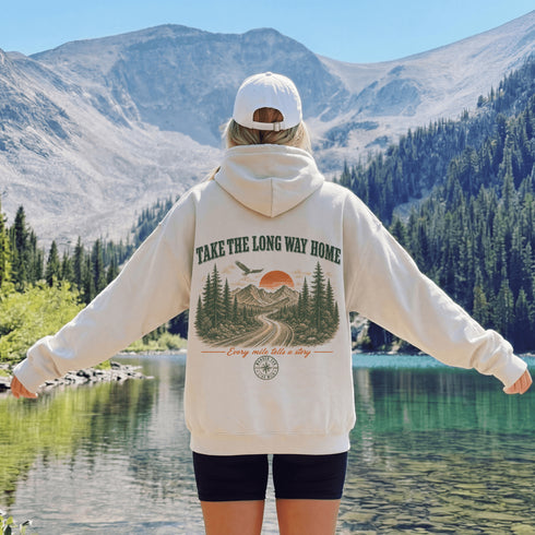 Vintage-inspired outdoor hoodie featuring a matching left chest graphic and large back graphic, displayed in a lifestyle mockup inspired by hiking, camping, scenic mountain roads, and outdoor adventures.