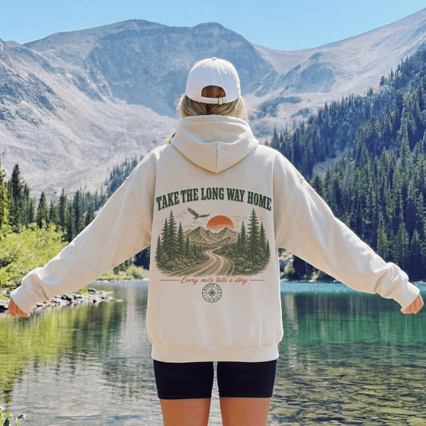 Vintage-inspired outdoor hoodie featuring a matching left chest graphic and large back graphic, displayed in a lifestyle mockup inspired by hiking, camping, scenic mountain roads, and outdoor adventures.