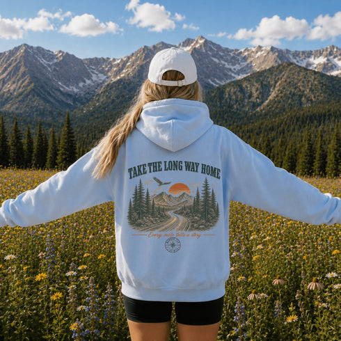 Vintage-inspired outdoor hoodie featuring a matching left chest graphic and large back graphic, displayed in a lifestyle mockup inspired by hiking, camping, scenic mountain roads, and outdoor adventures.