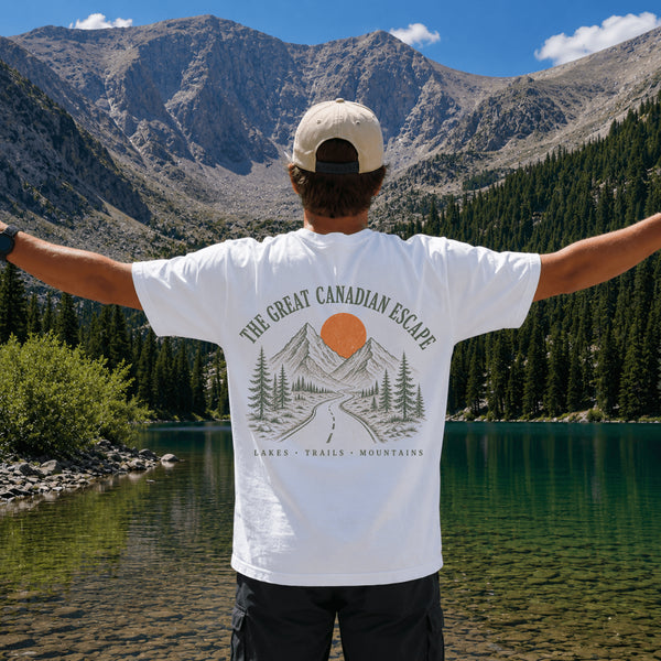 Vintage mountain adventure graphic printed on a Comfort Colors® 1717 garment-dyed t-shirt featuring a matching left chest pocket design and large back print, available in multiple colours.