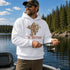 A man wearing a white hoodie with a 'The Rodfather' graphic of a man holding a fishing rod and fish stands on a boat by a lake with pine trees in the background.